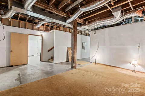 a view of a kitchen with furniture and a kitchen