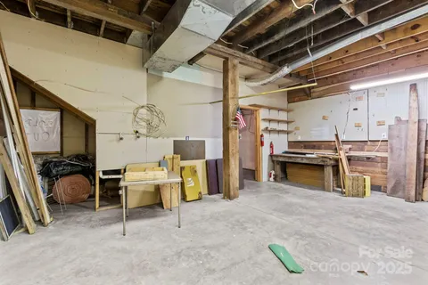 a bathroom with a toilet sink and shower