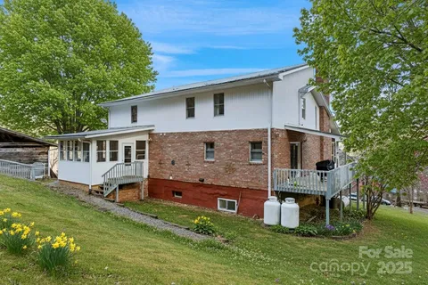 a backyard of a building with trees