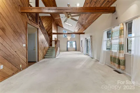 a view of two chairs in the balcony