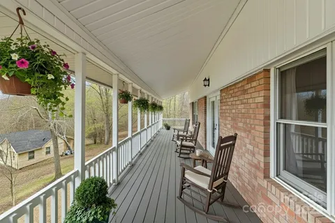a kitchen with stainless steel appliances granite countertop a stove and a wooden cabinets