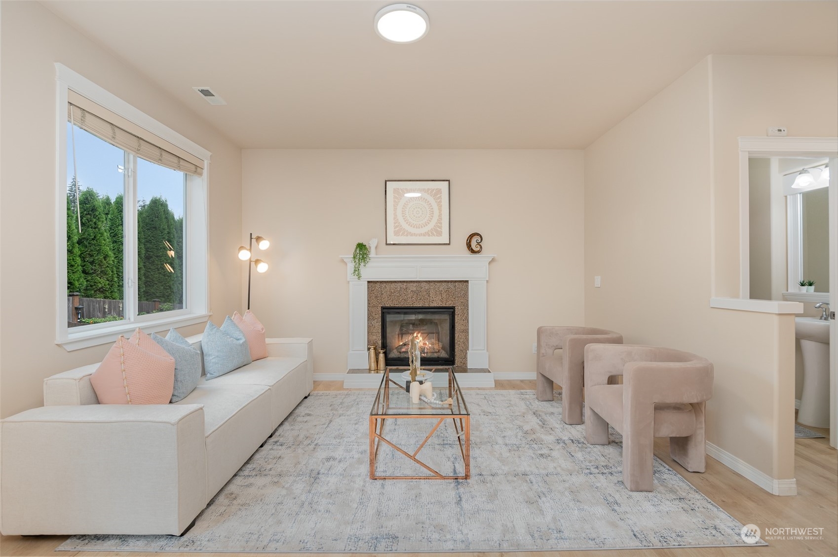 115 161st Place Southeast Bothell, WA 98012 - Photo 12 of 38 a living room with furniture a large window and a fireplace