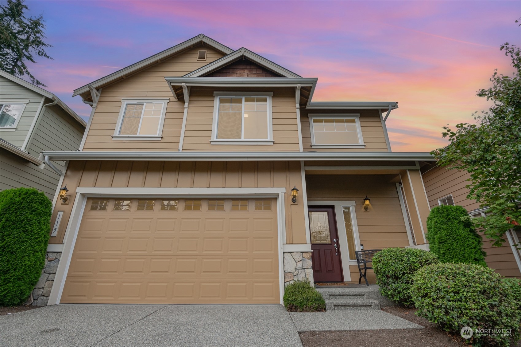 115 161st Place Southeast Bothell, WA 98012 - Photo 2 of 38 a front view of a house with garage
