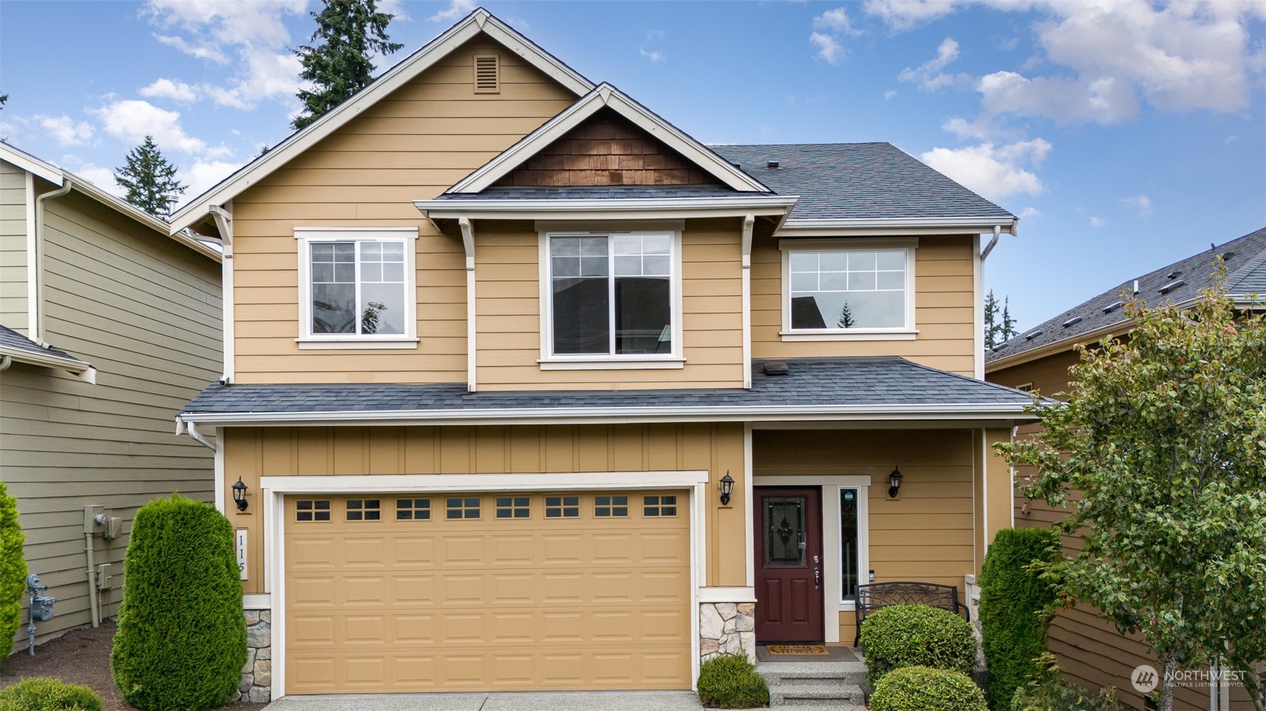 115 161st Place Southeast Bothell, WA 98012 - Photo 3 of 38 a front view of a house with garage