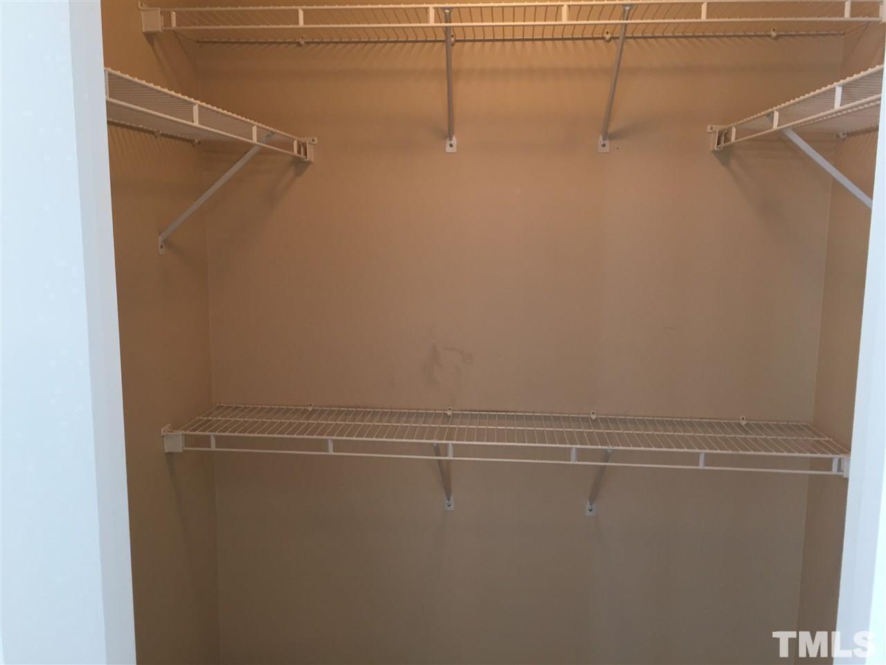 8605 London Park Court Raleigh, NC 27615 - Photo 13 of 18 a view of a room with racks on the wall