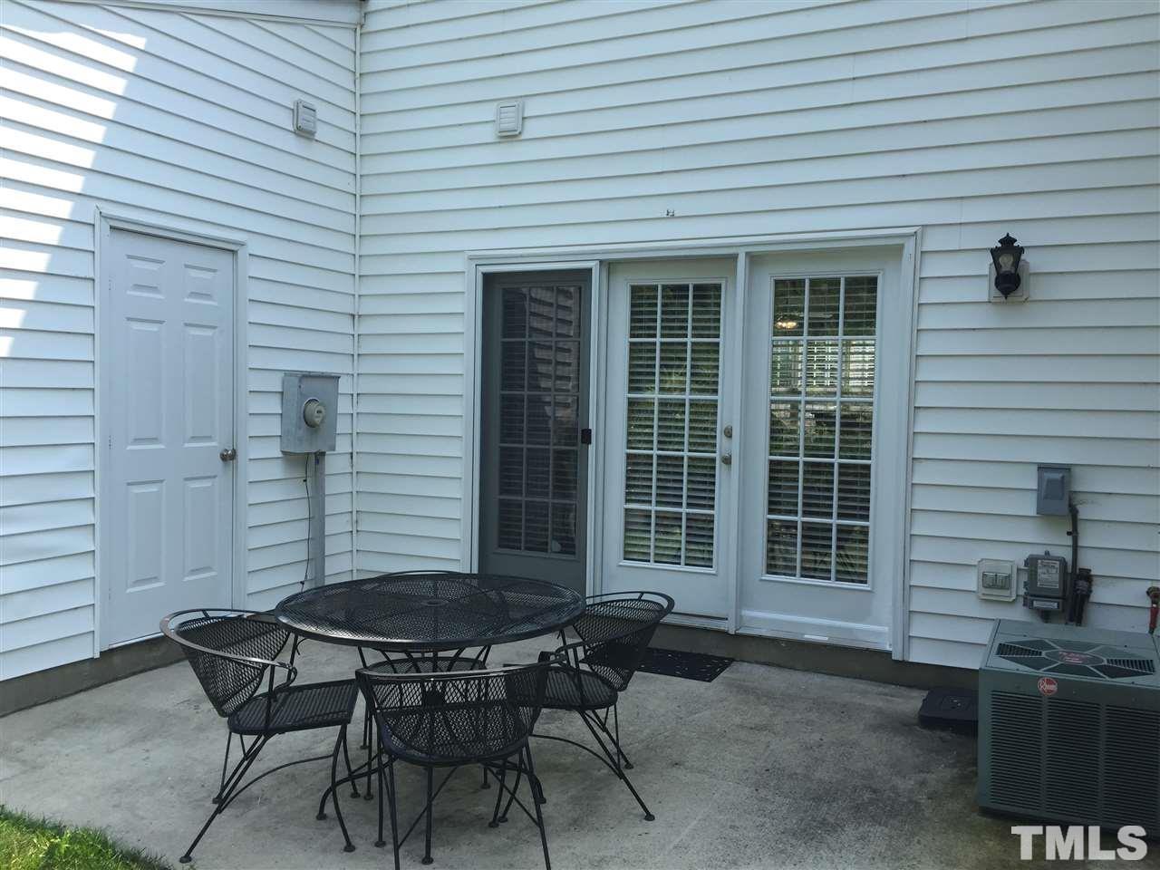 8605 London Park Court Raleigh, NC 27615 - Photo 17 of 18 a backyard of a house with table and chairs