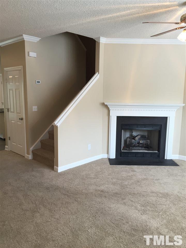 8605 London Park Court Raleigh, NC 27615 - Photo 3 of 18 a view of an empty room with a fireplace