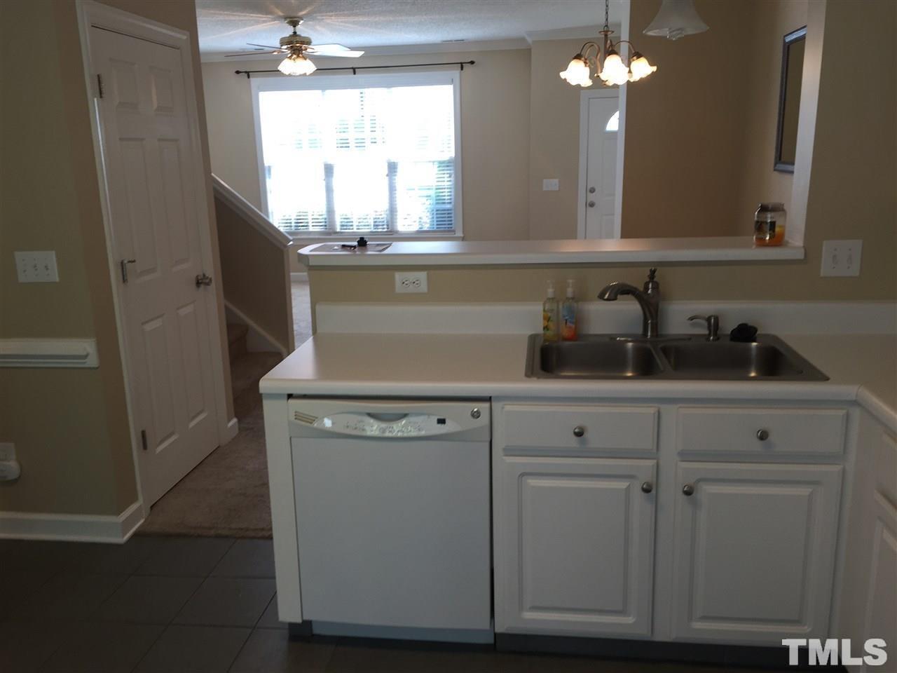 8605 London Park Court Raleigh, NC 27615 - Photo 8 of 18 a view of a sink a mirror and cabinets in a room
