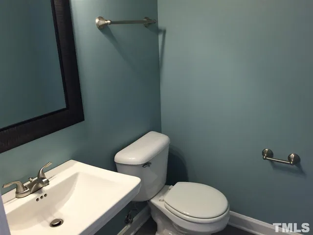 a view of a kitchen with a sink dishwasher and a refrigerator