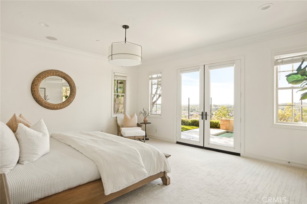 3 Kent Court Ladera Ranch, CA 92694 - Photo 20 of 68 The Mainfloor Primary Suite offers panoramic views and French Doors that open to the backyard spa.