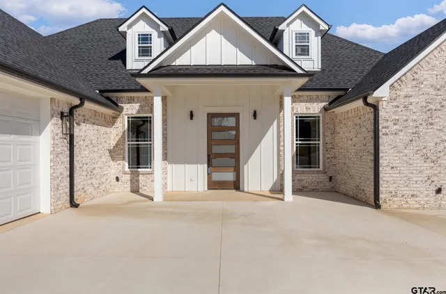 a front view of a house with a garage
