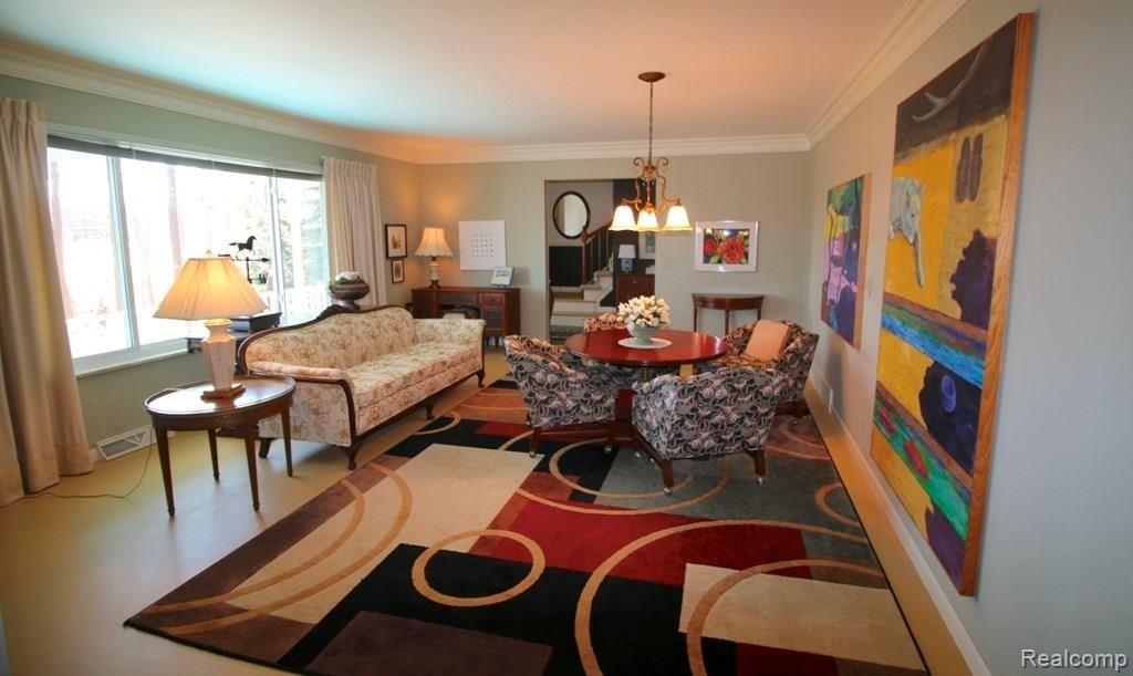 1080 West Highland Road Howell, MI 48843 - Photo 10 of 37 LIVING ROOM WITH PAINTED FLOOR