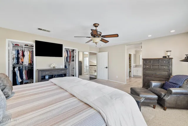 a bed room with a bed and a television