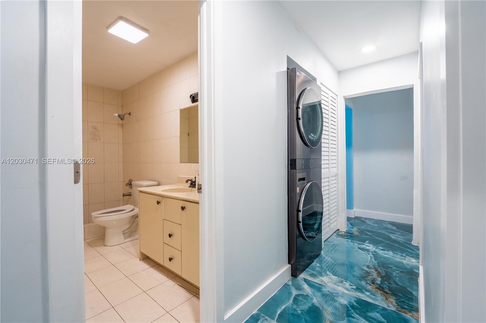 11851 Southwest 181st Street Miami, FL 33177 - Photo 9 of 25 a bathroom with a granite countertop sink and a mirror