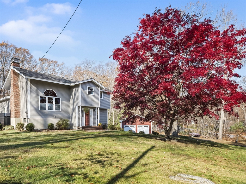 29 Woobly Road Bolton, MA 01740 - Photo 1 of 1 a front view of a house with a yard