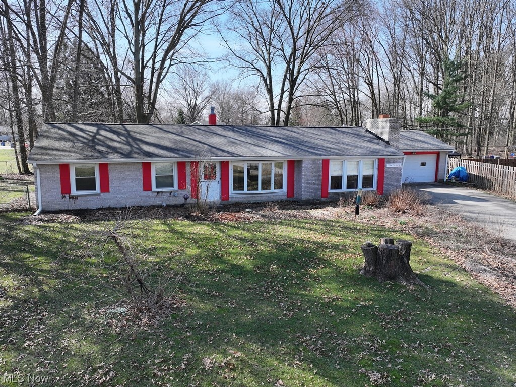 1450 Bonnie Road Macedonia, OH 44056 - Photo 1 of 21 Ranch-style house with a front lawn