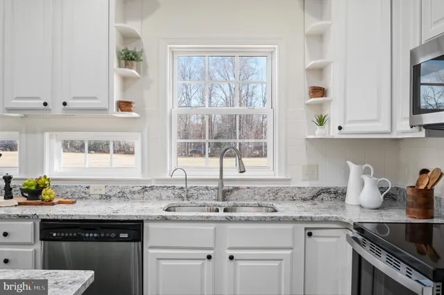 a spacious bathroom with a double vanity sink and a bathtub
