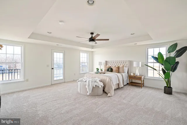 a bath tub sitting in a bathroom next to a window