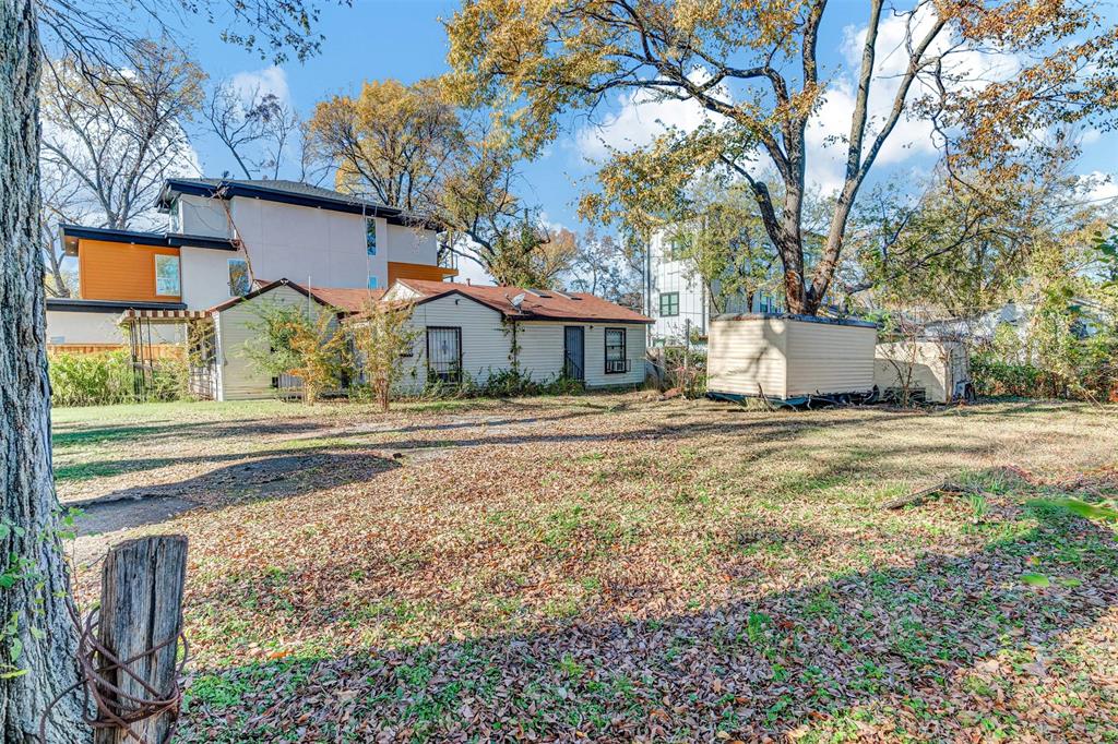 917 Walkway Street Dallas, TX 75212 - Photo 15 of 15 a front view of a house with a yard and large trees