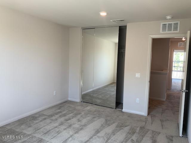 312 Dominguez Street Camarillo, CA 93010 - Photo 17 of 25 an empty room with closet and wooden floor