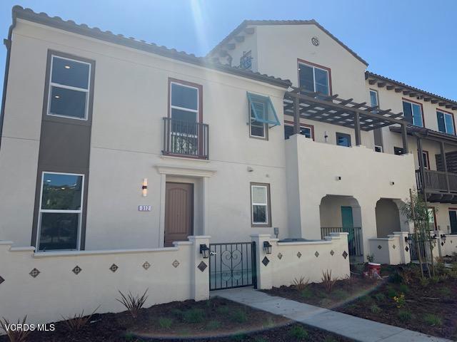 312 Dominguez Street Camarillo, CA 93010 - Photo 2 of 25 a view of a white building with entryway