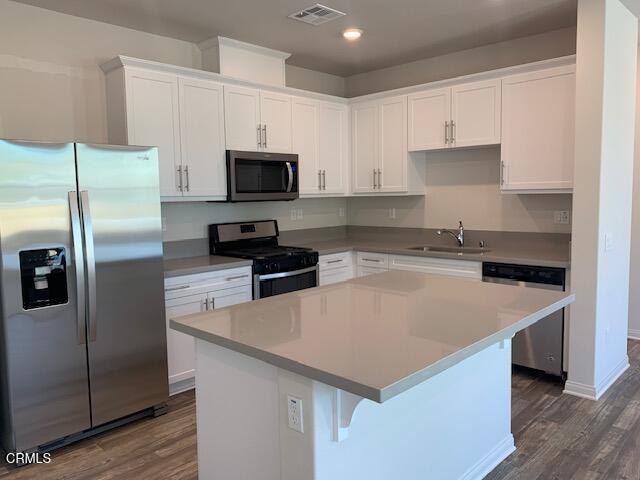 312 Dominguez Street Camarillo, CA 93010 - Photo 3 of 25 a kitchen with kitchen island a sink stainless steel appliances and cabinets