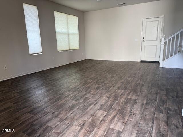 312 Dominguez Street Camarillo, CA 93010 - Photo 4 of 25 an empty room with wooden floor and windows