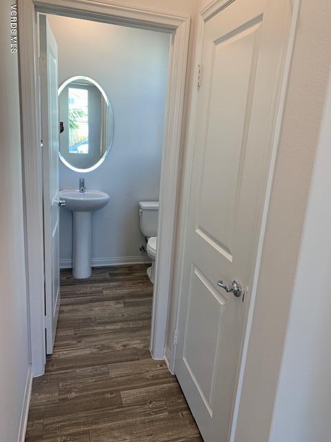 312 Dominguez Street Camarillo, CA 93010 - Photo 8 of 25 a view of a hallway with wooden floor and staircase