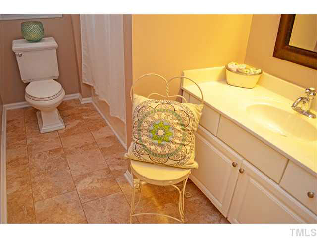 7617 Overland Trail Raleigh, NC 27615 - Photo 12 of 25 a bathroom with a toilet and a sink