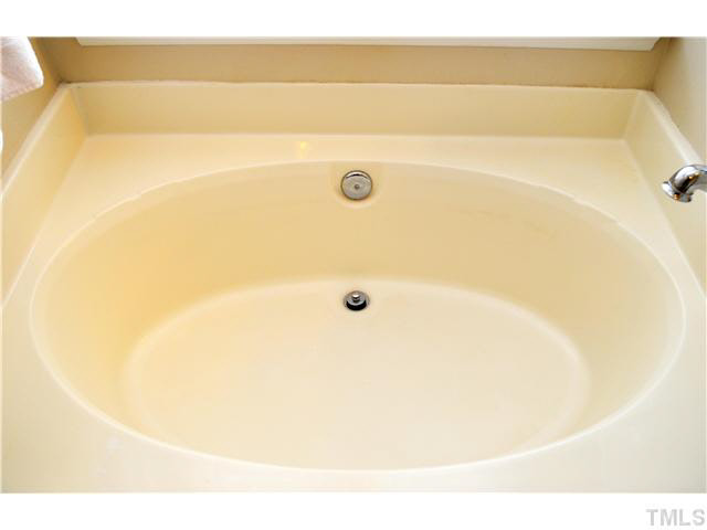 7617 Overland Trail Raleigh, NC 27615 - Photo 21 of 25 a bathroom with a bathtub