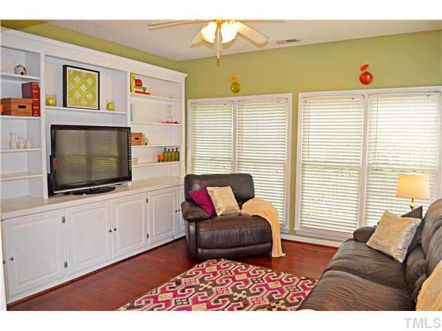 7617 Overland Trail Raleigh, NC 27615 - Photo 10 of 25 a living room with furniture and a flat screen tv