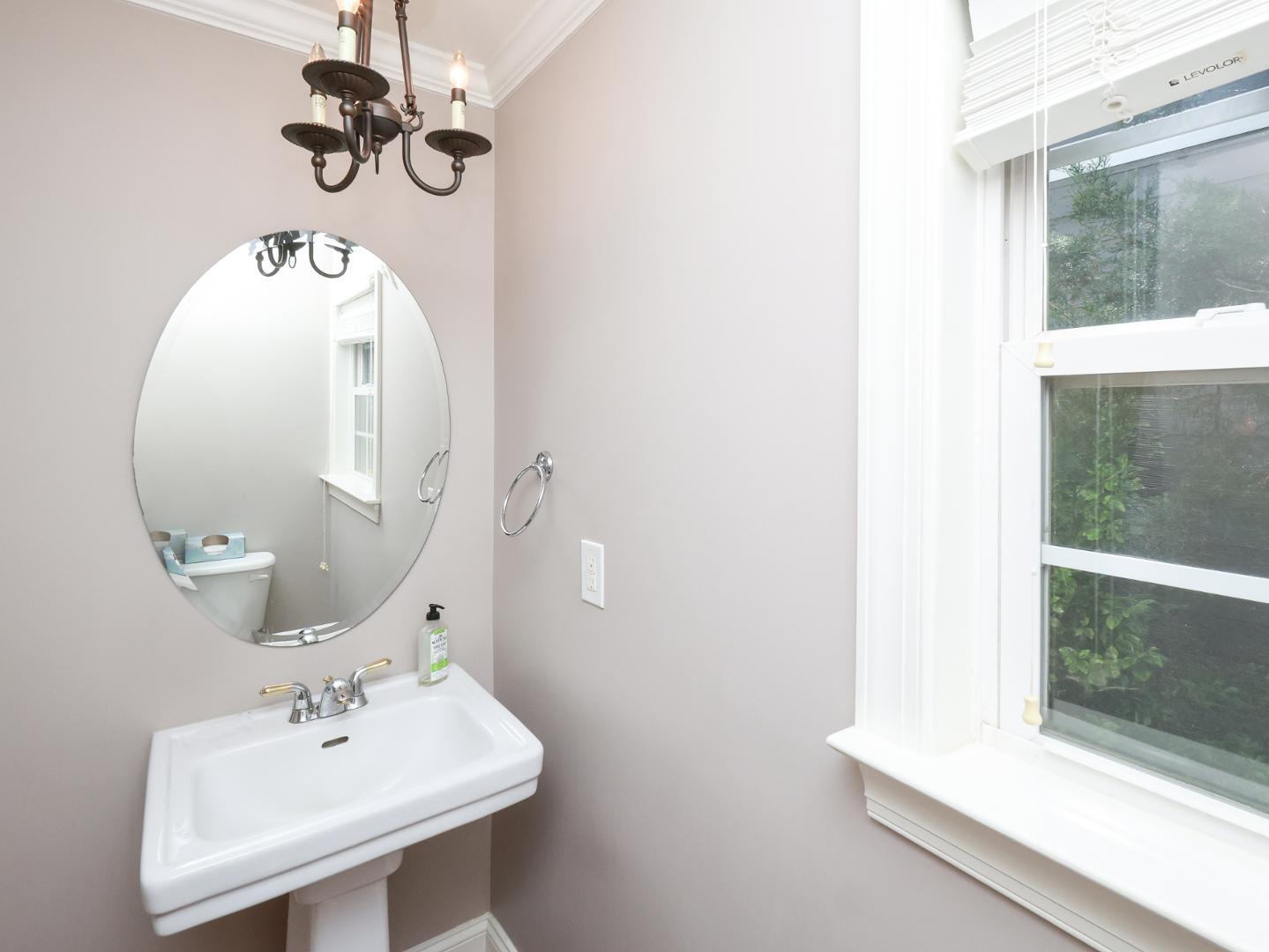 1155 Harp Street Raleigh, NC 27604 - Photo 16 of 33 a bathroom with a sink and a mirror