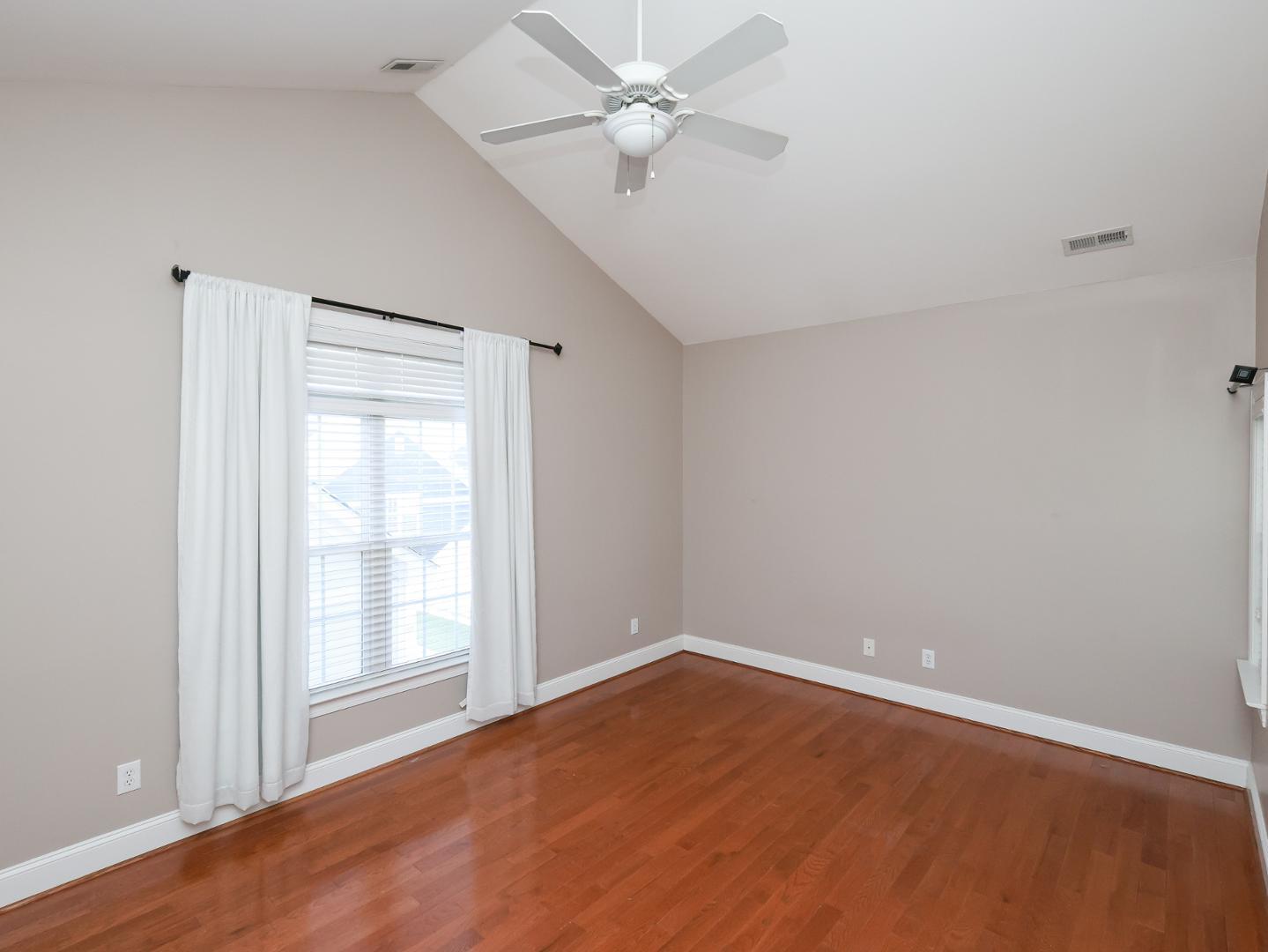 1155 Harp Street Raleigh, NC 27604 - Photo 17 of 33 wooden floor in an empty room with a window