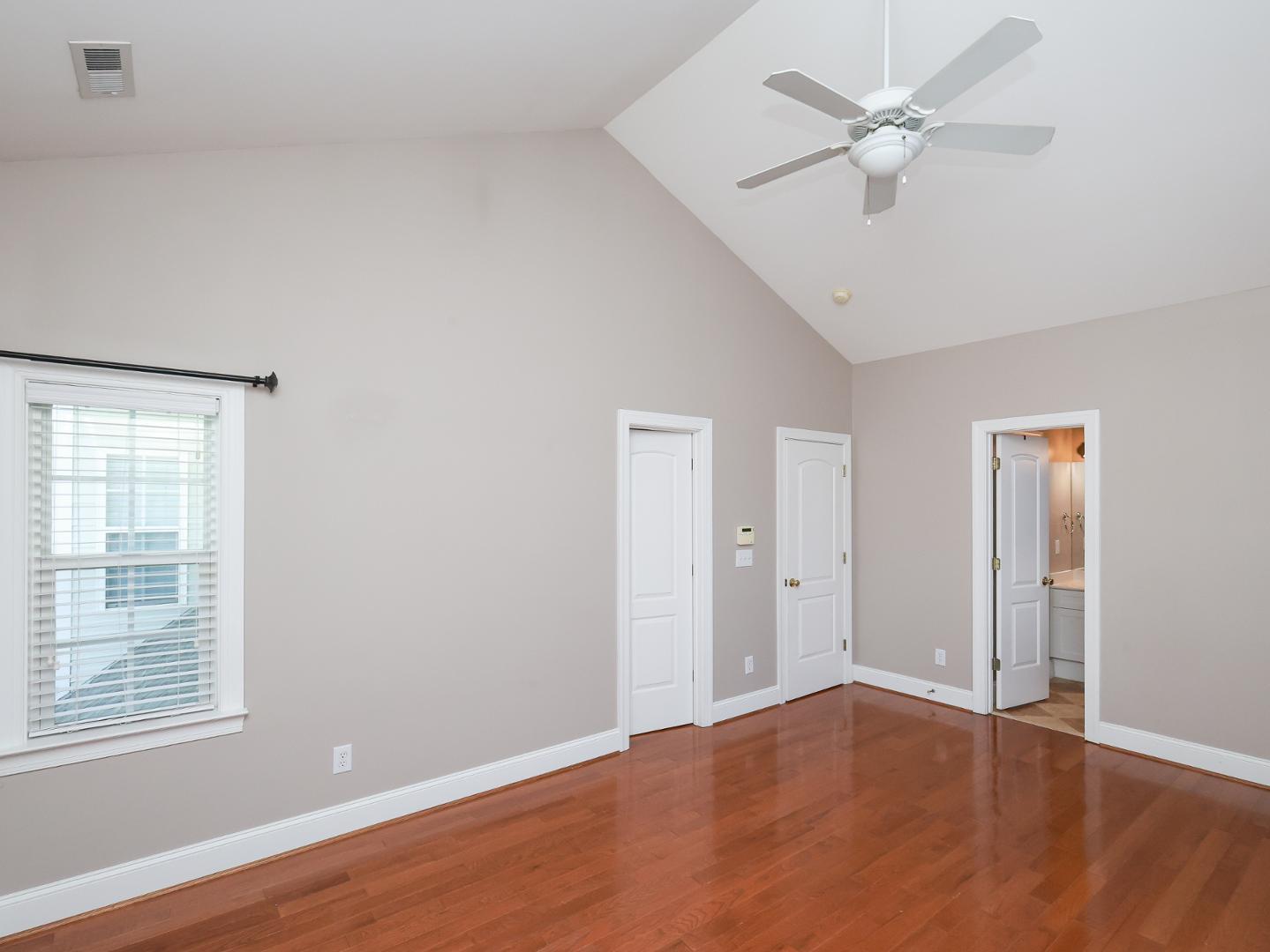 1155 Harp Street Raleigh, NC 27604 - Photo 18 of 33 wooden floor in an empty room with a window