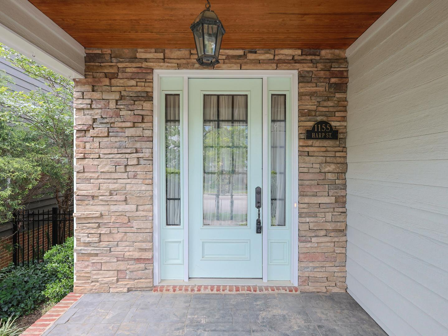 1155 Harp Street Raleigh, NC 27604 - Photo 2 of 33 a view of a brick house with glass windows