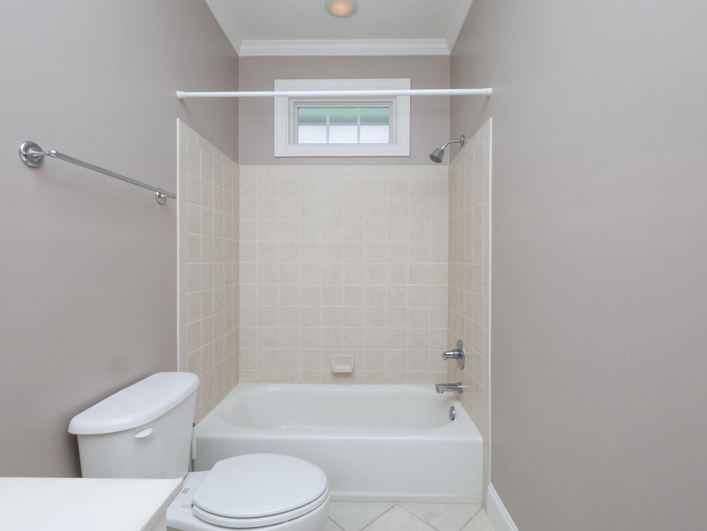 1155 Harp Street Raleigh, NC 27604 - Photo 29 of 33 a bathroom with a toilet and a bath tub