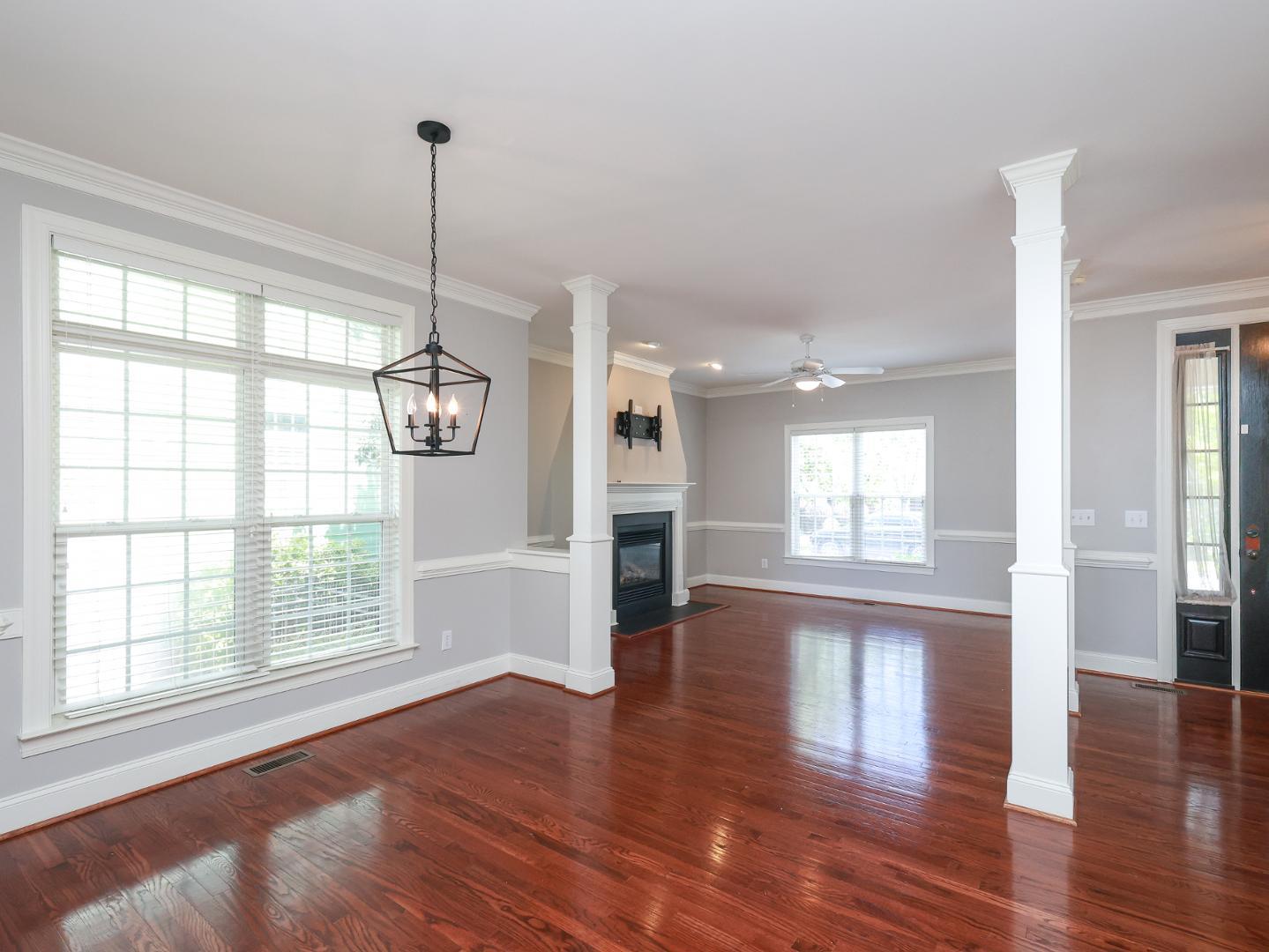 1155 Harp Street Raleigh, NC 27604 - Photo 8 of 33 a view of empty room with wooden floor and windows