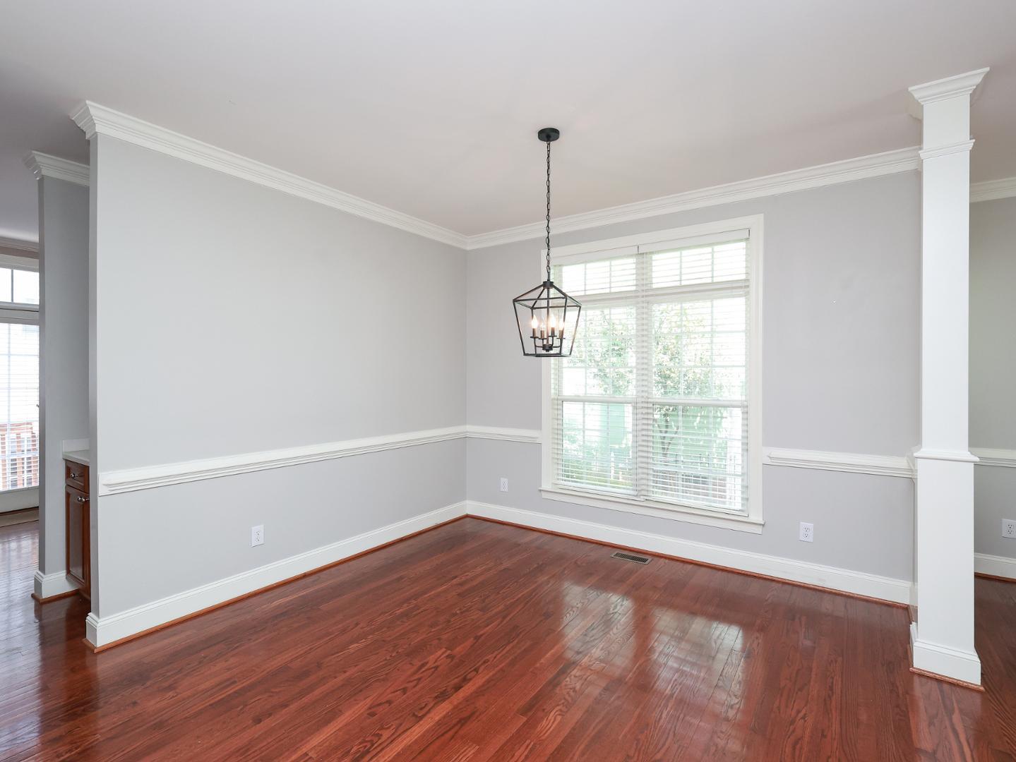 1155 Harp Street Raleigh, NC 27604 - Photo 9 of 33 a view of an empty room with wooden floor and a window