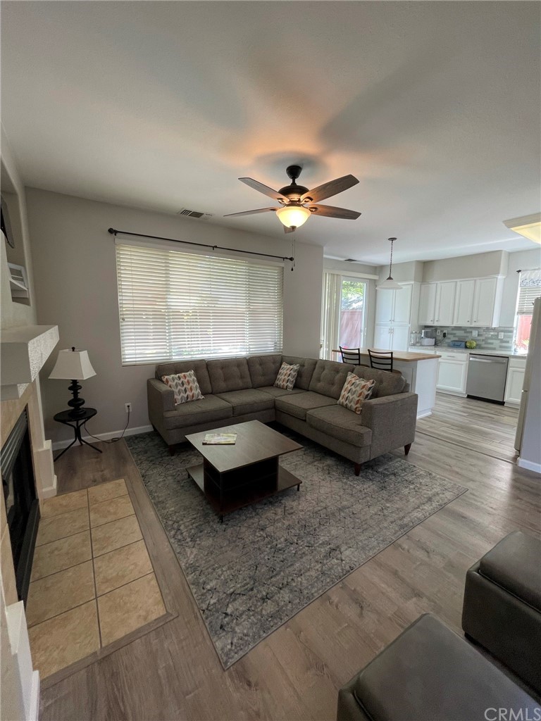 2832 Cottage Lane Paso Robles, CA 93446 - Photo 6 of 19 a living room with furniture and a chandelier
