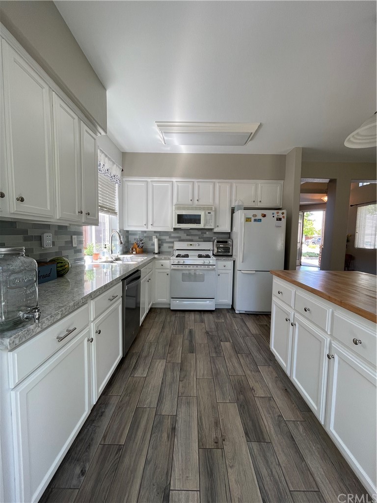 2832 Cottage Lane Paso Robles, CA 93446 - Photo 10 of 19 a kitchen with cabinets a sink and wooden floor