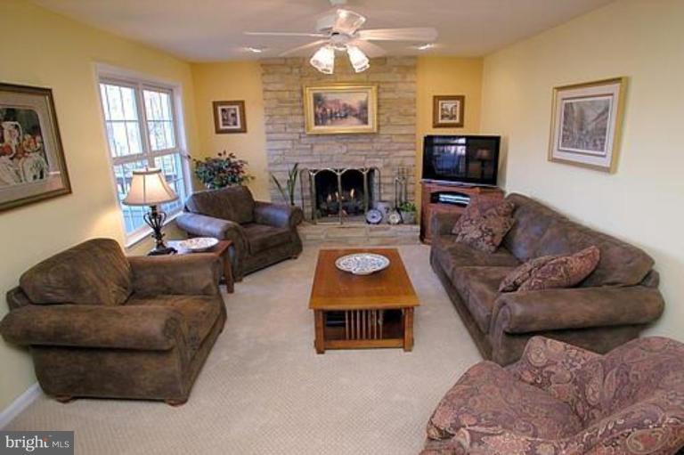 9986 Old Frederick Road Ellicott City, MD 21042 - Photo 8 of 30 a living room with furniture wooden floor and a fireplace