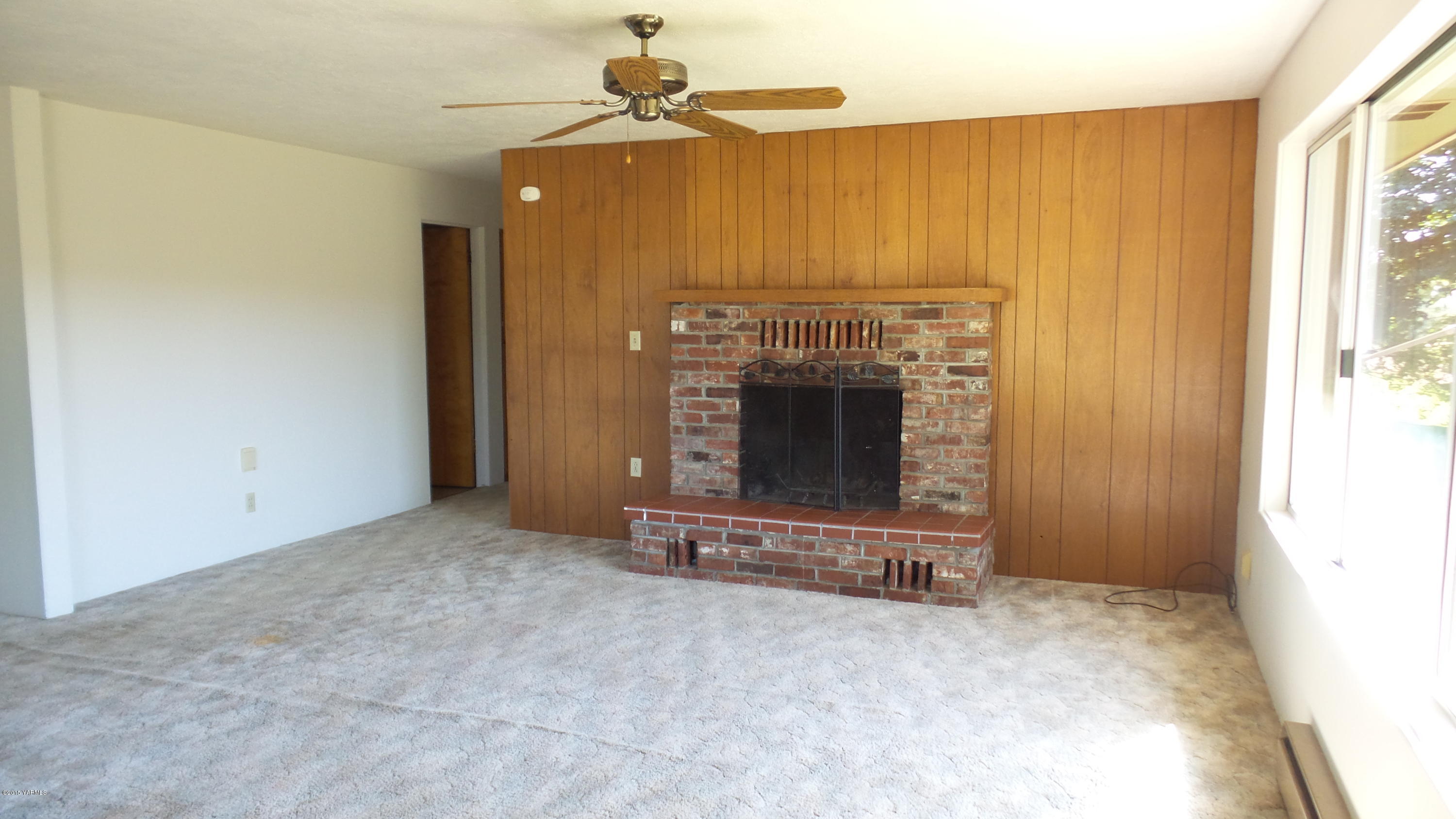 71 West Canyon Road Yakima, WA 98908 - Photo 4 of 19 a view of an empty room with a fireplace