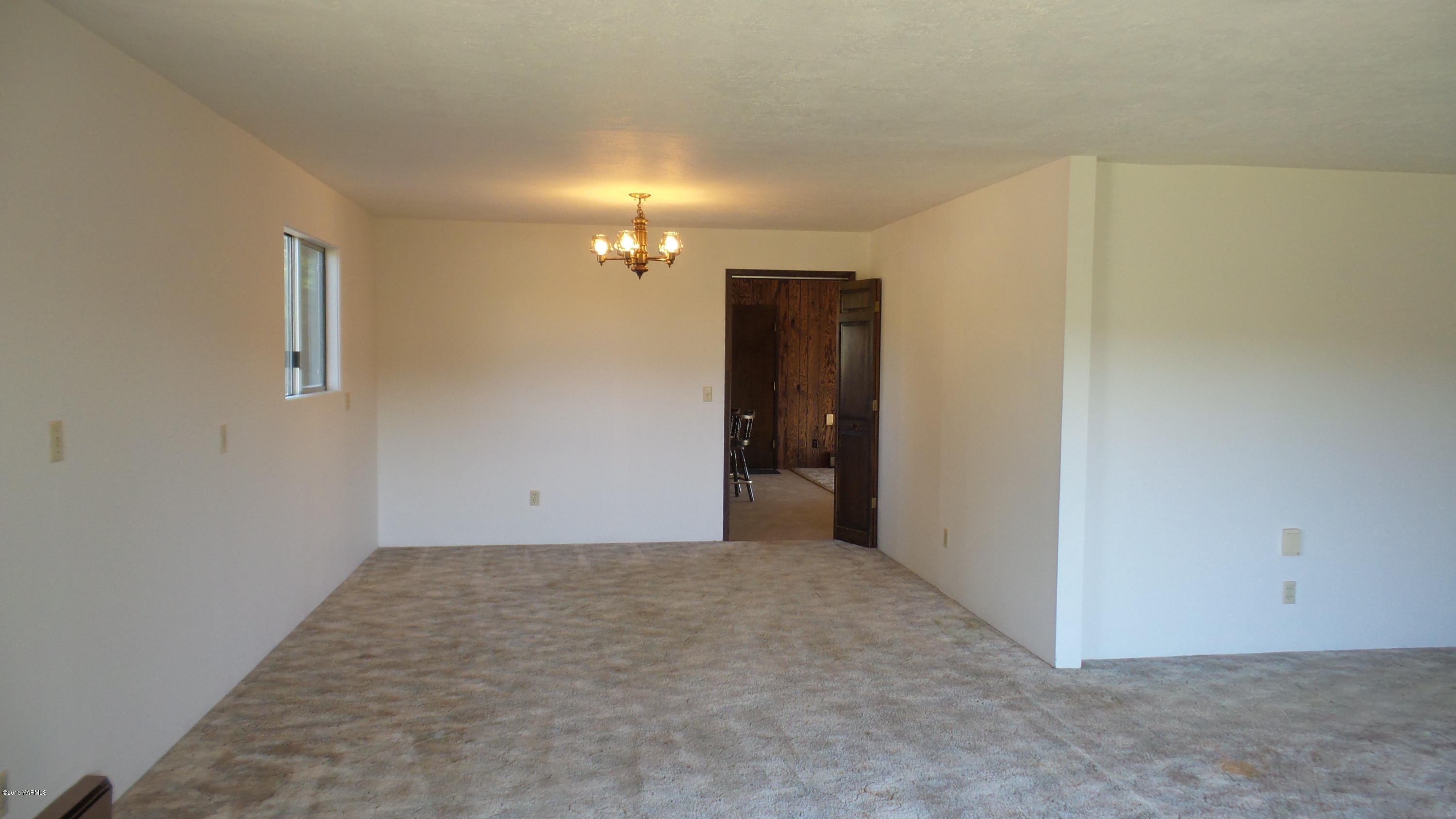 71 West Canyon Road Yakima, WA 98908 - Photo 5 of 19 a view of an empty room with a chandelier fan