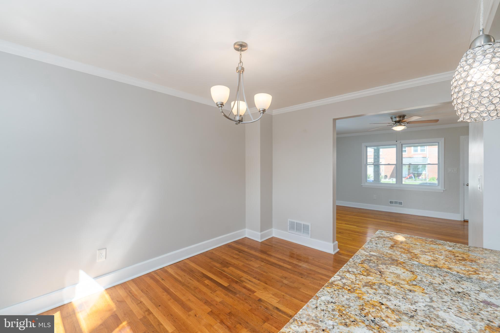 1738 Stokesley Road Baltimore, MD 21222 - Photo 2 of 34 a view of a livingroom with wooden floor and a large window