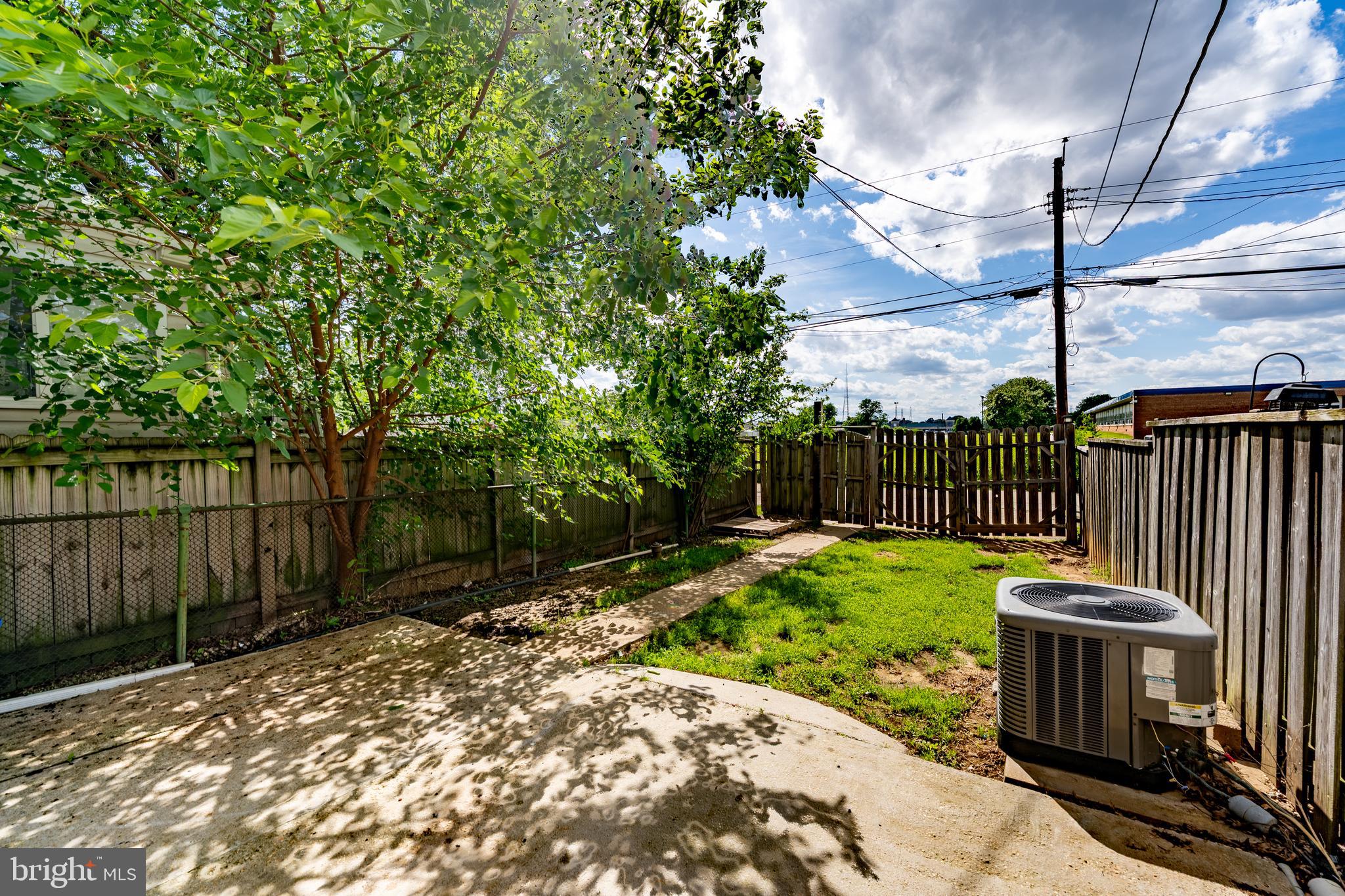 1738 Stokesley Road Baltimore, MD 21222 - Photo 27 of 34 a view of a backyard with wooden fence