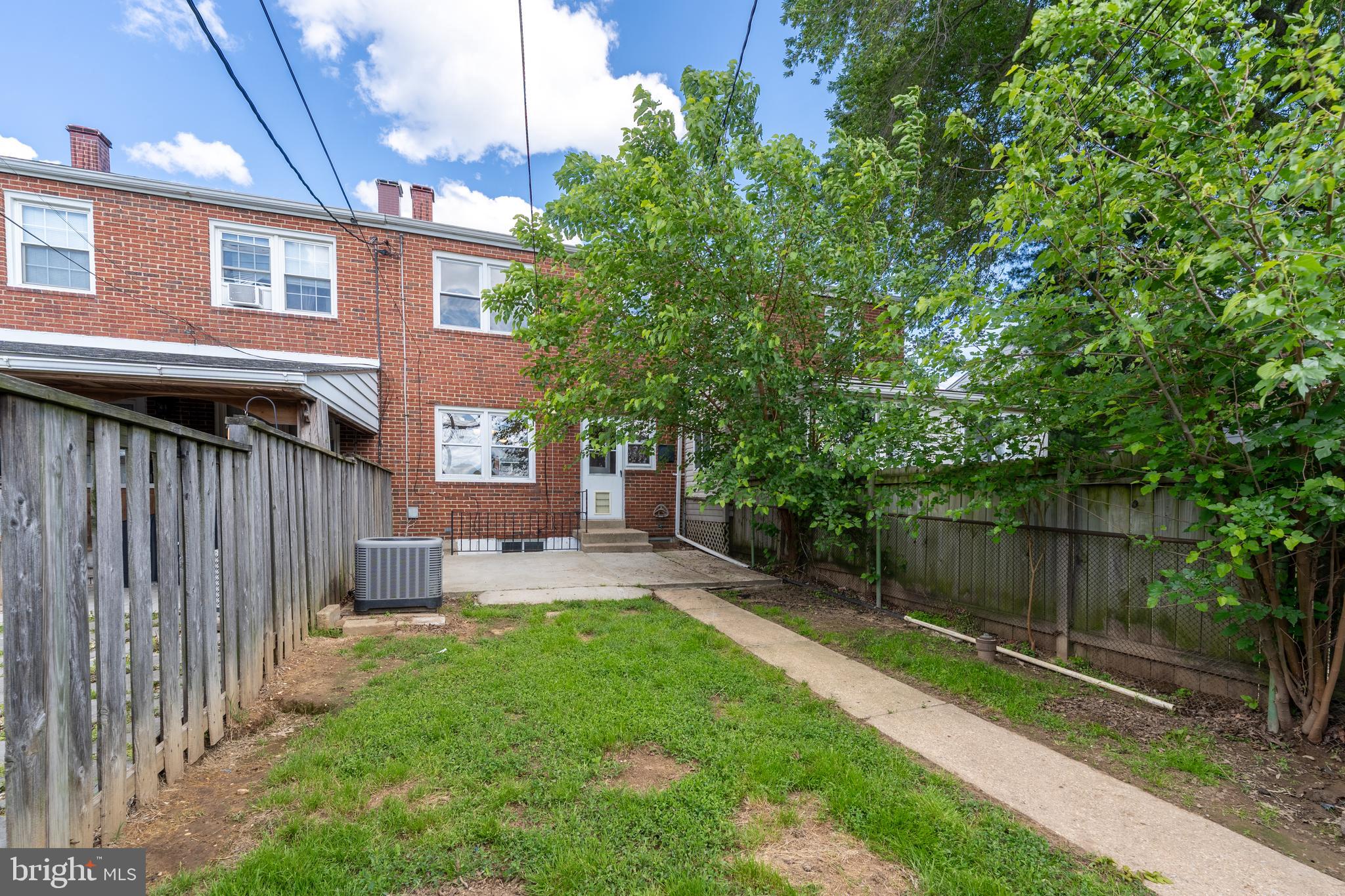 1738 Stokesley Road Baltimore, MD 21222 - Photo 28 of 34 a view of a house with a yard and sitting area