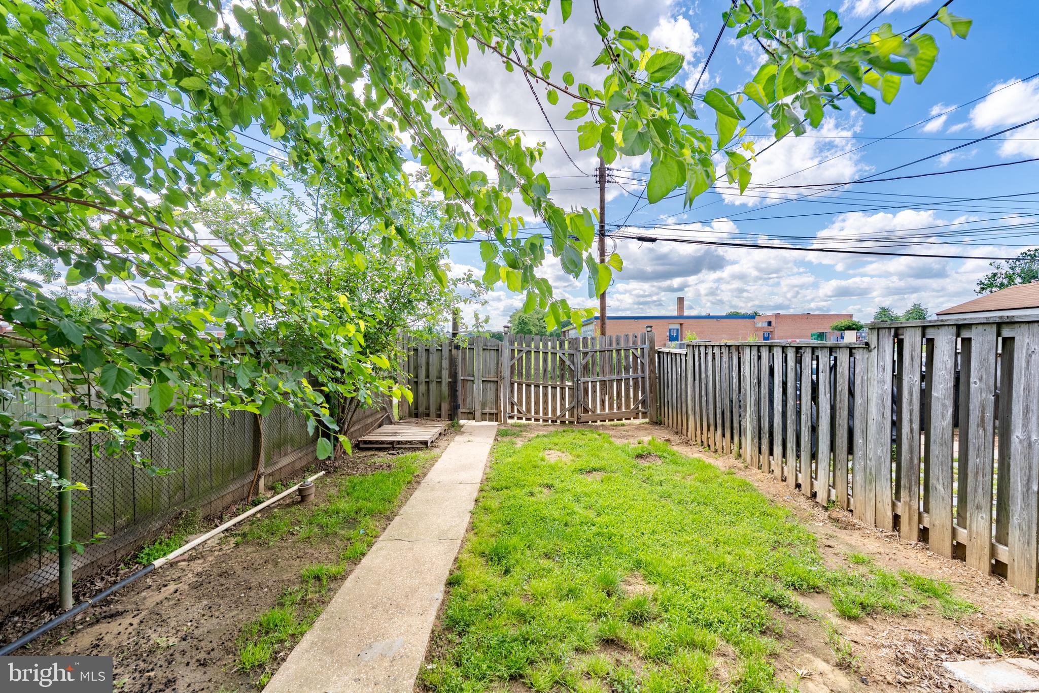 1738 Stokesley Road Baltimore, MD 21222 - Photo 29 of 34 a view of a backyard with wooden fence