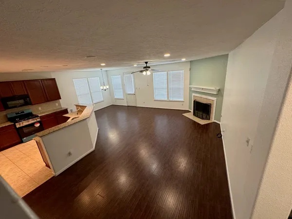 a view of a livingroom with furniture and a fireplace