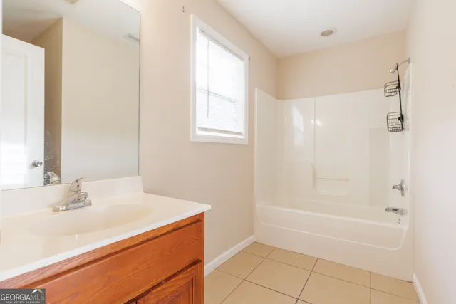 a bathroom with a sink a vanity and a mirror
