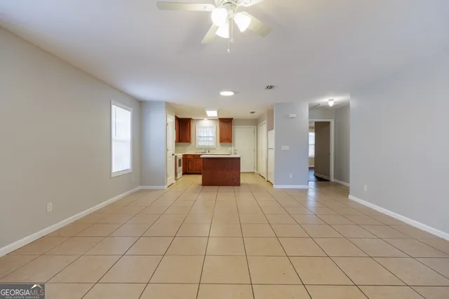 a view of a kitchen with a sink and a window